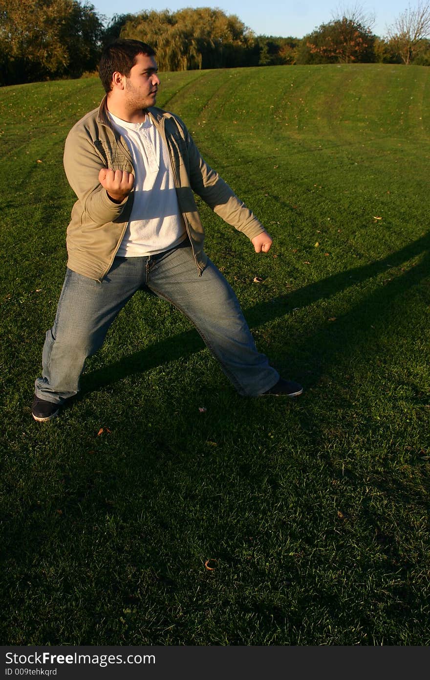 Shotokan karate training in the park in the afternoon