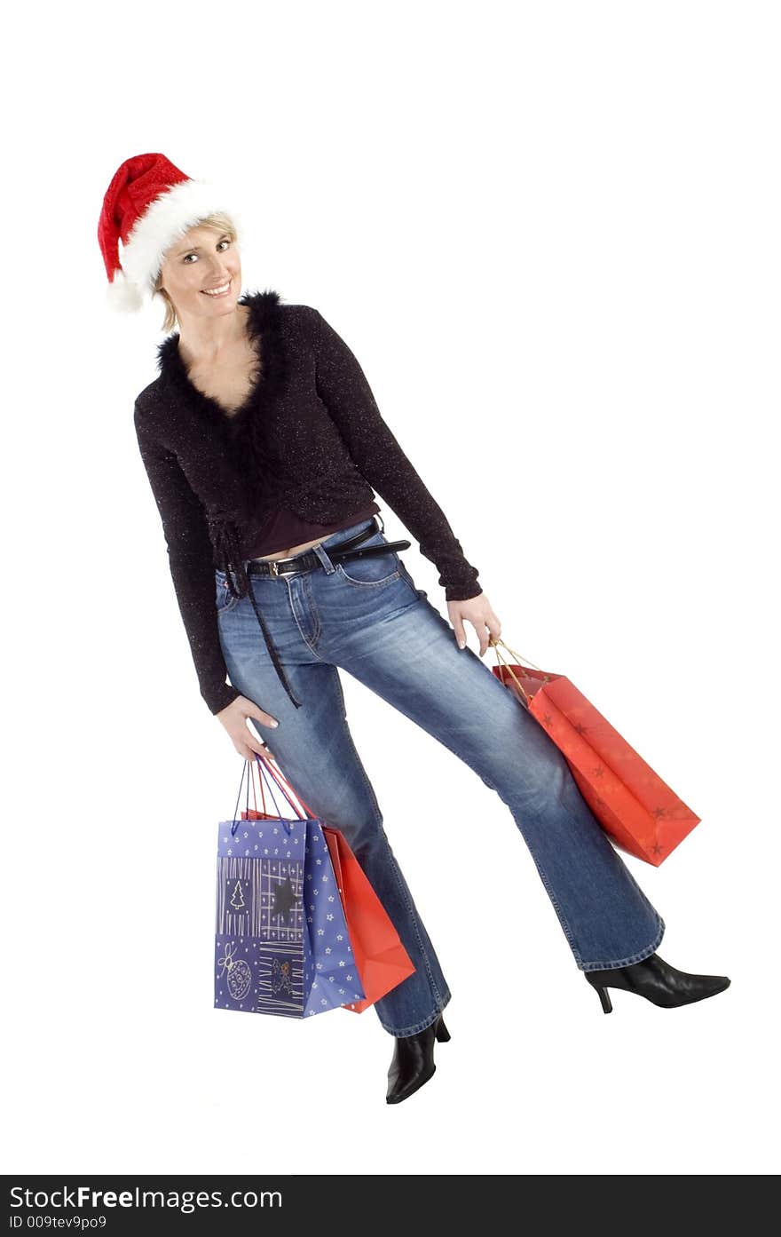 Young female posing with christmas bags on white. Young female posing with christmas bags on white