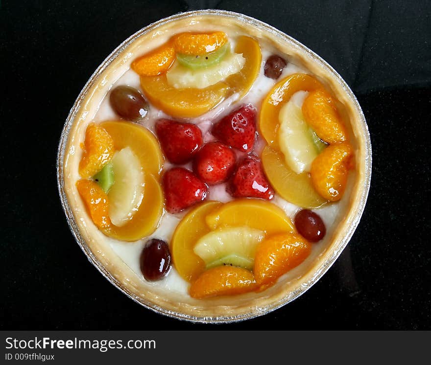 Summer garden fruits in a sweet glazed cream pie dessert