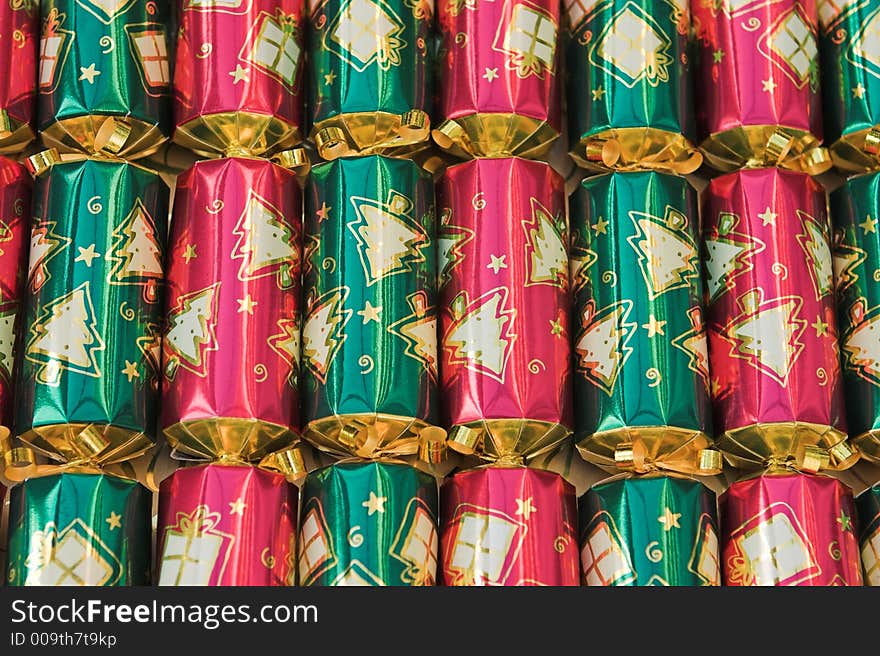 Red & green christmas crackers all lined up