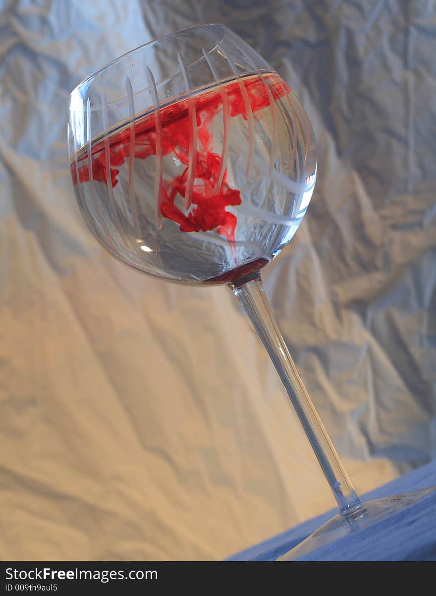 Red dye swirling in water. Red dye swirling in water