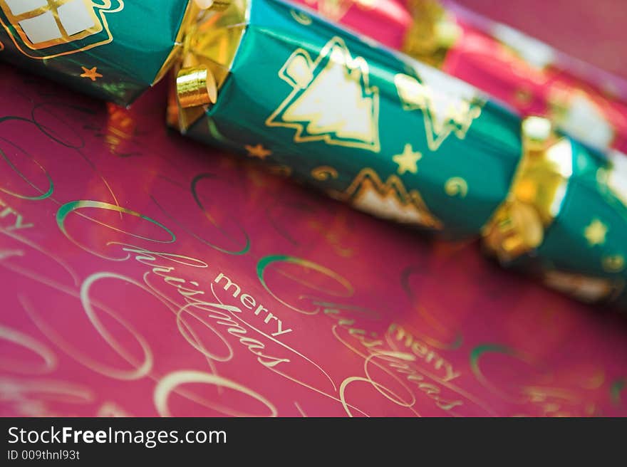 Red & green christmas crackers - focus around the words 'merry christmas'