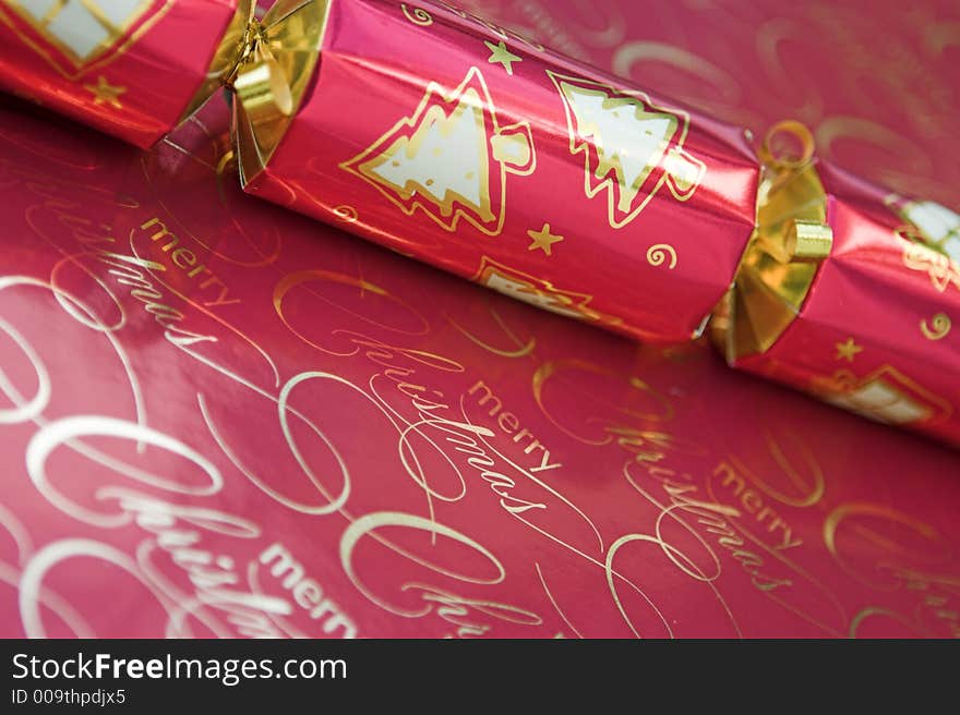 Red christmas cracker - focus around the words 'merry christmas'. Red christmas cracker - focus around the words 'merry christmas'