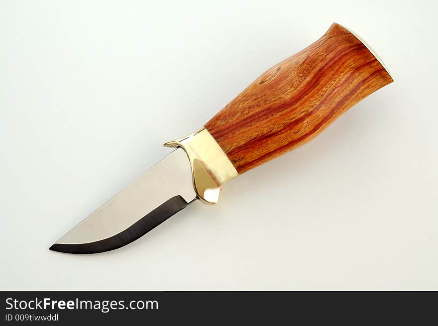 A hand made knife with rosewood handle. A hand made knife with rosewood handle