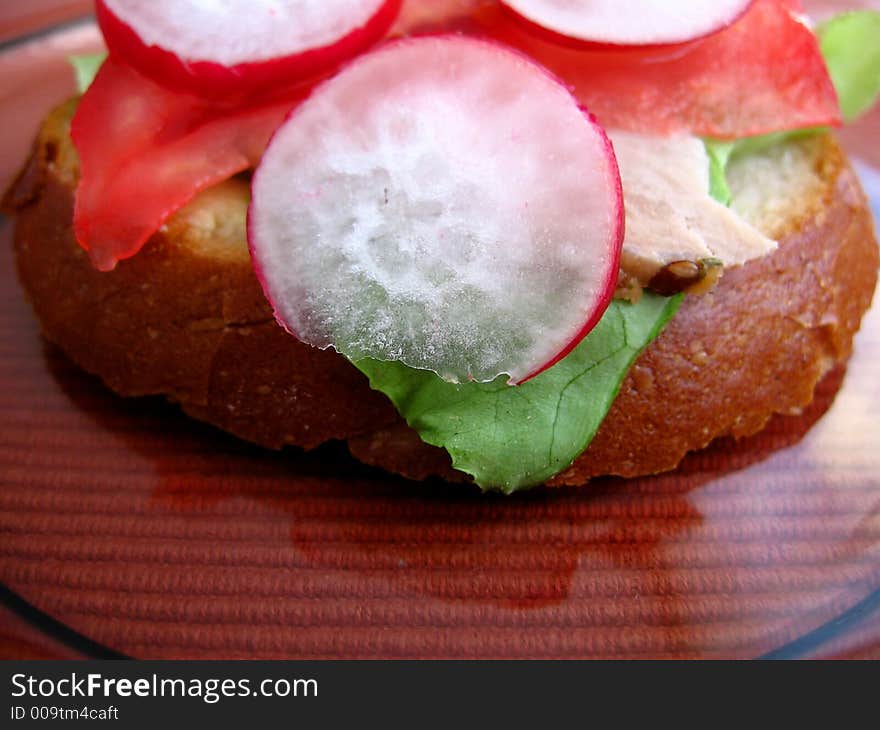 Fresh spring time sandwich:

bread, butter, lettuce, pork, tomato, radish