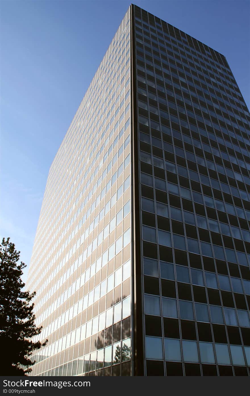 High business building in front of a blue sky. High business building in front of a blue sky.