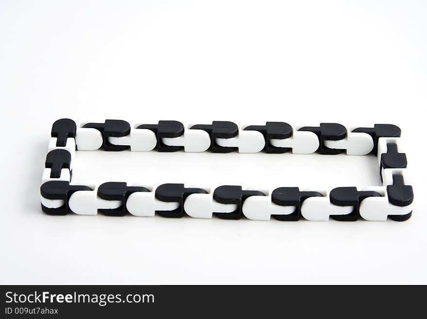 A chain toy that teachers give to students that have adhd or add to help them focus while studying over white background