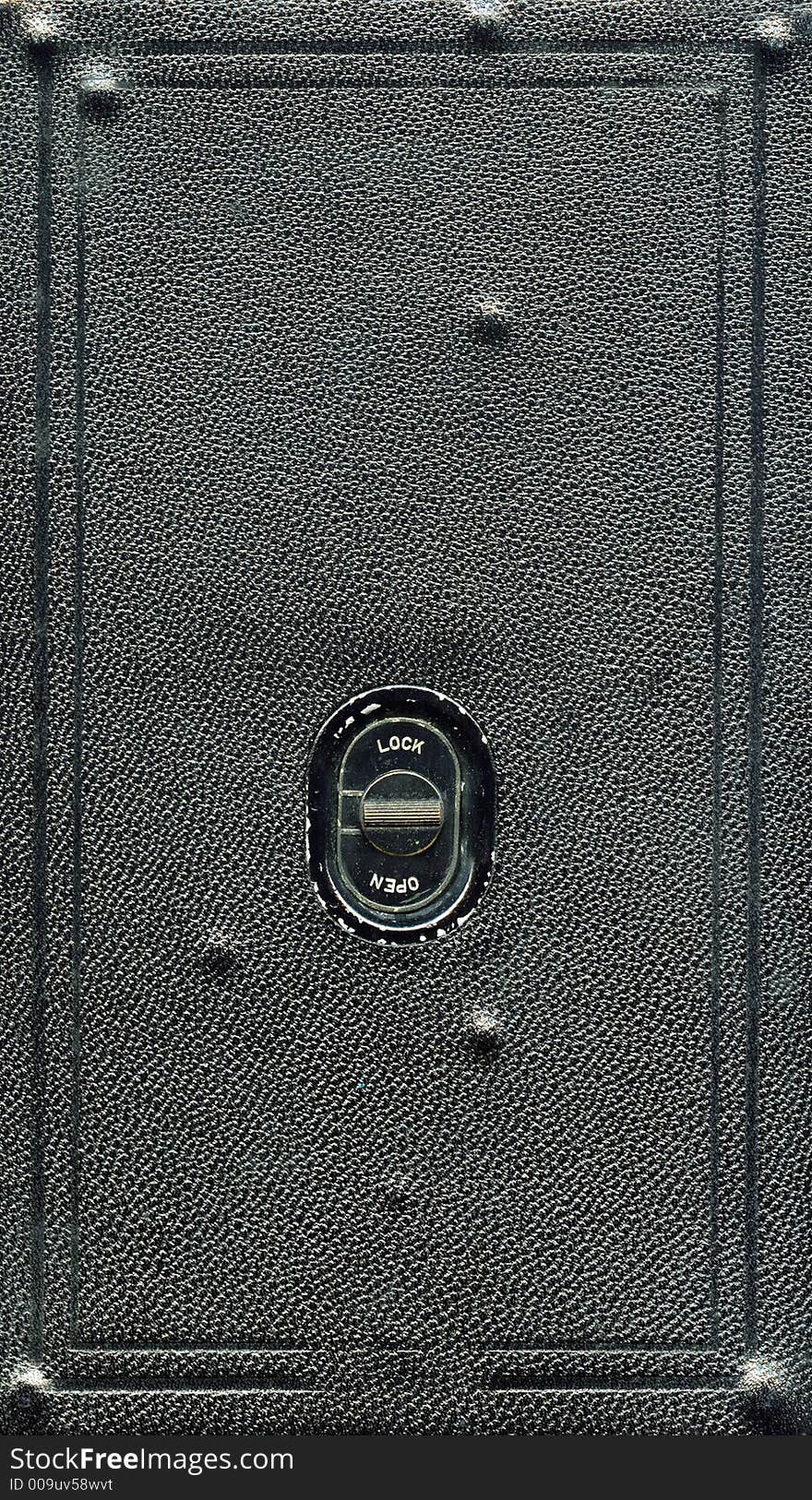 Detail of an antique camera showing the locking mechanism. Detail of an antique camera showing the locking mechanism