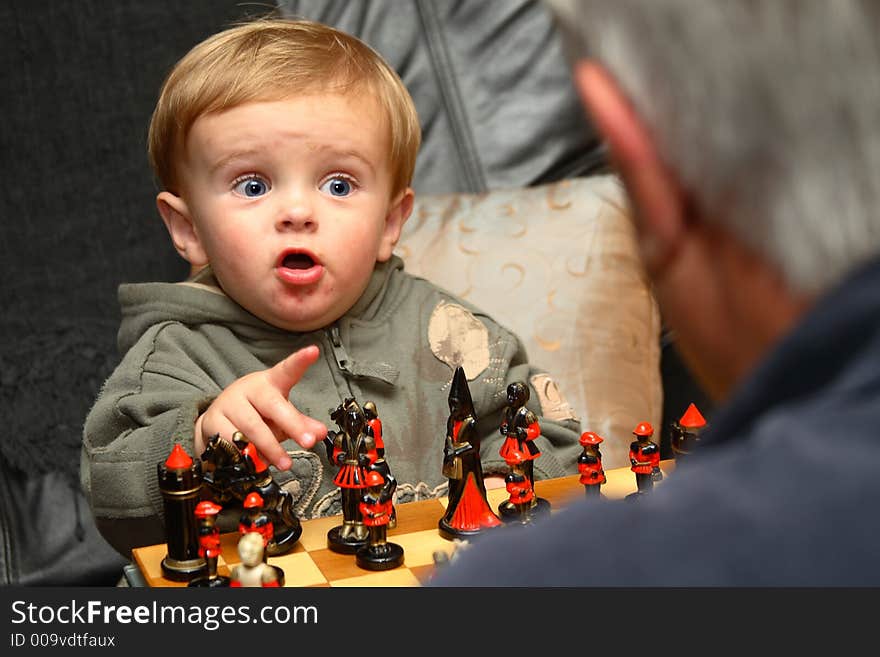 Young boy playing chess