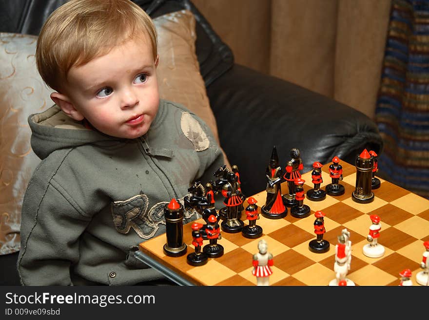 Young boy playing chess