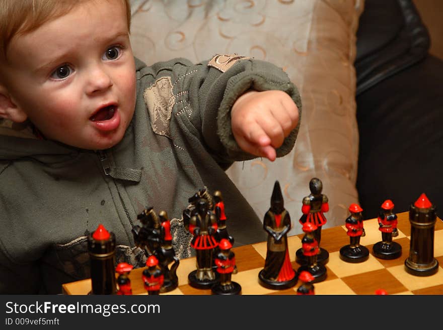 Young boy playing chess