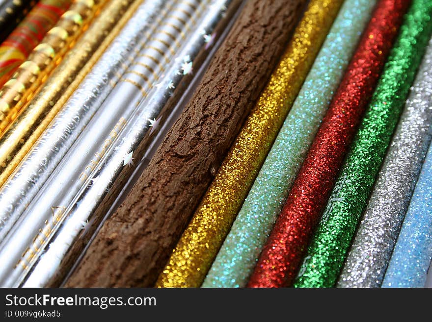 Unusual pencil made of natural wood among multi-coloured sparkling pencils horizontal. Unusual pencil made of natural wood among multi-coloured sparkling pencils horizontal