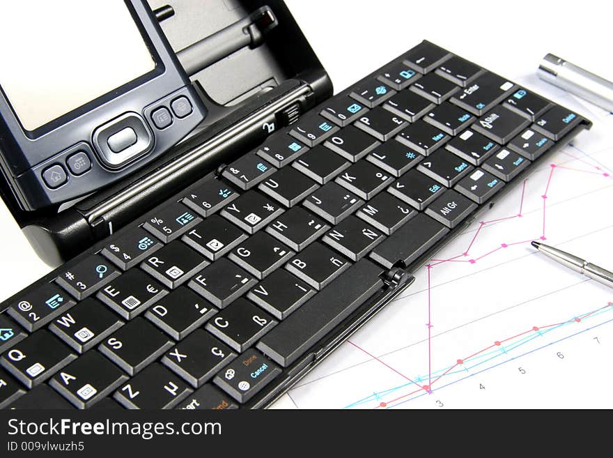 PDA and keyboard with chart on white background