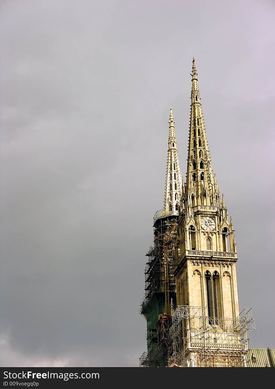 Church towers renovating with cloudy sky