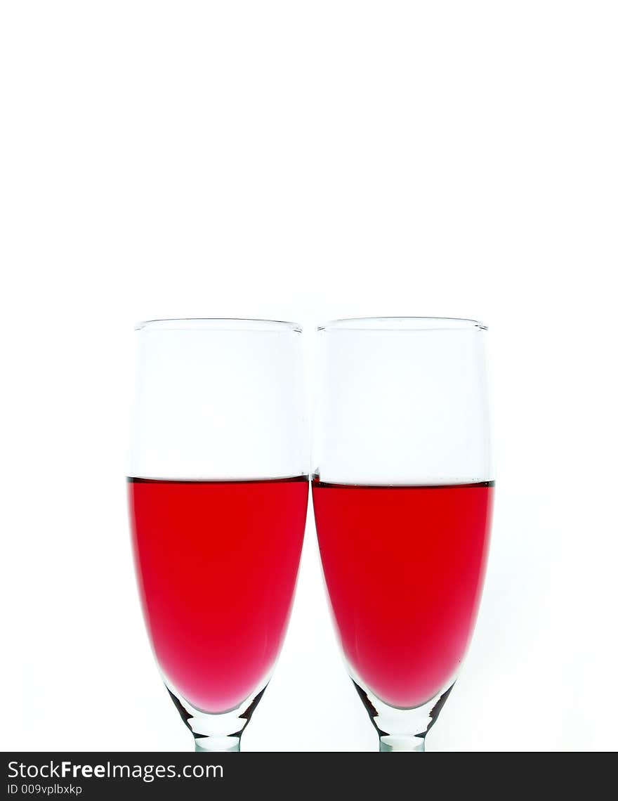 Red wine over white background