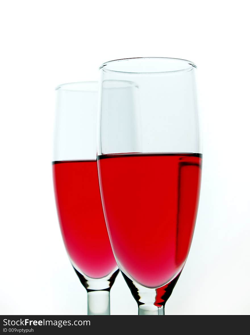 Red wine over white background