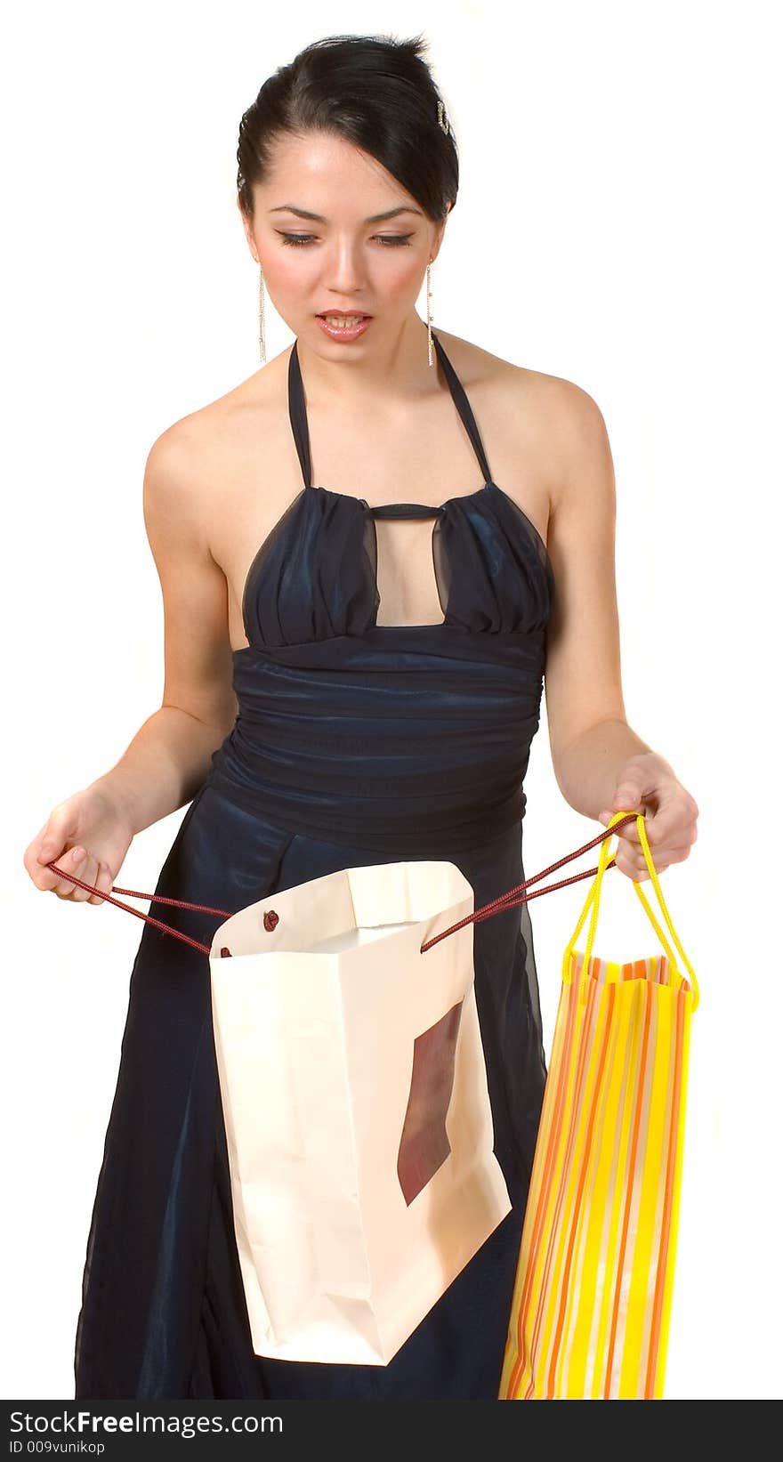 An attractive woman checks her shopping bags