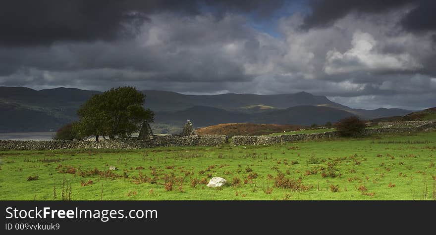 A dry stone dwelling lies abandoned above the Mawddach Estuary in Wales.