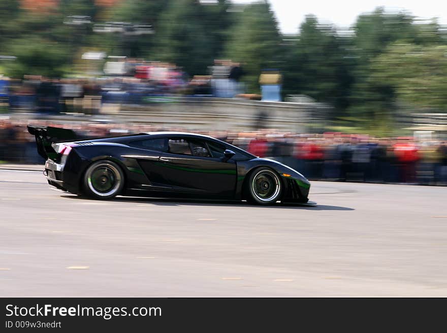 Black monster car speeding on the road