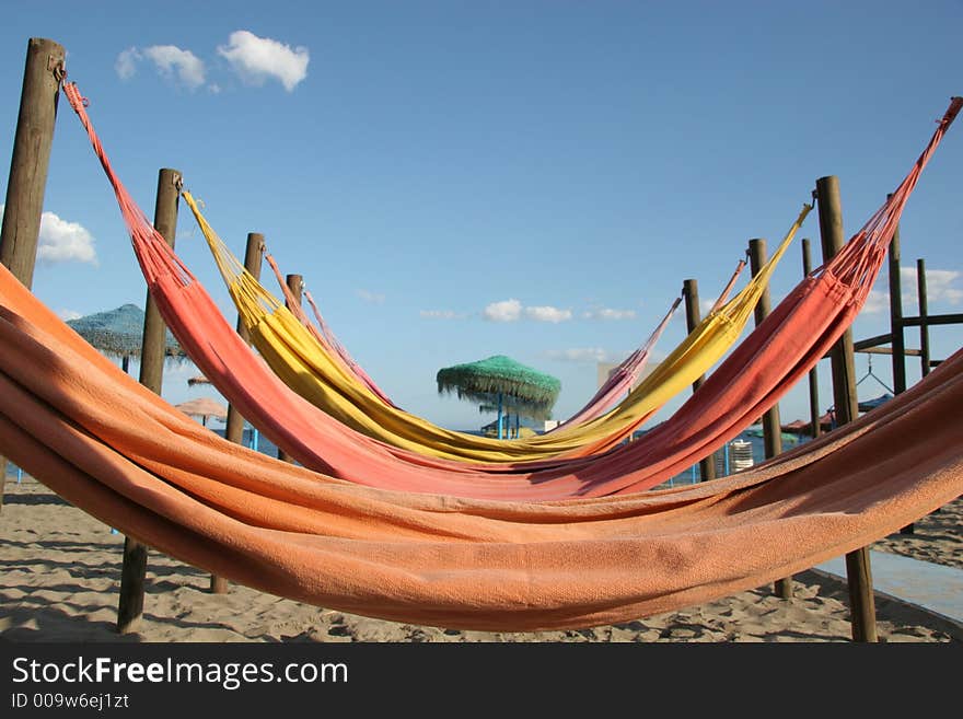 Colorful hammocks on a beach