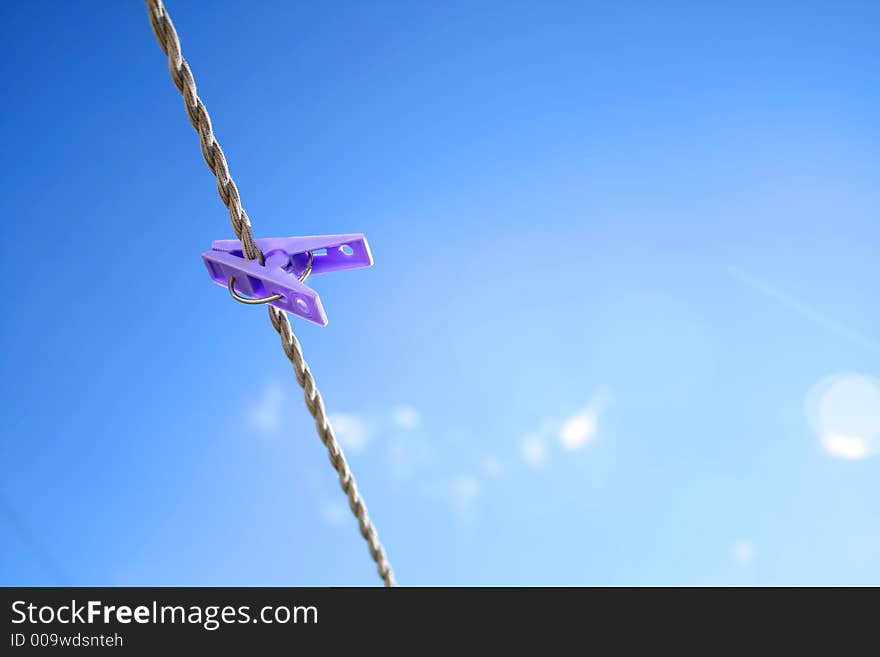 Clothes line with a purple peg