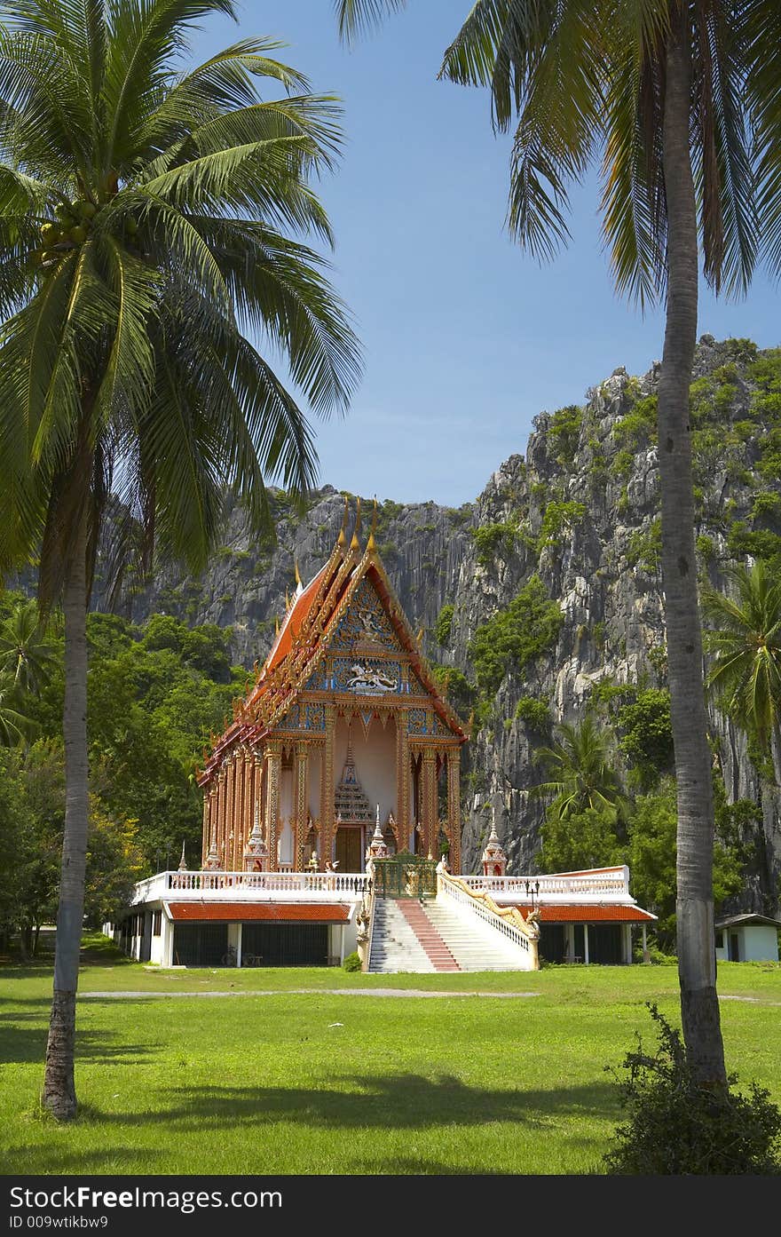 Buddhist shrine complex surrounded by rocks and palms. Buddhist shrine complex surrounded by rocks and palms