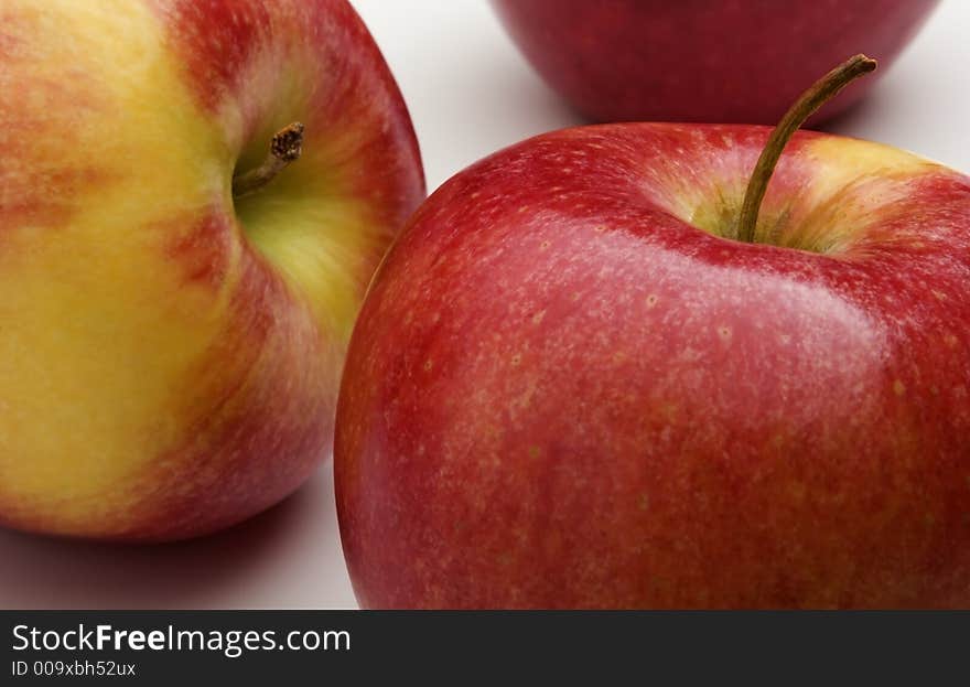 Close-up detail of several pinata apples on a white background. Close-up detail of several pinata apples on a white background.