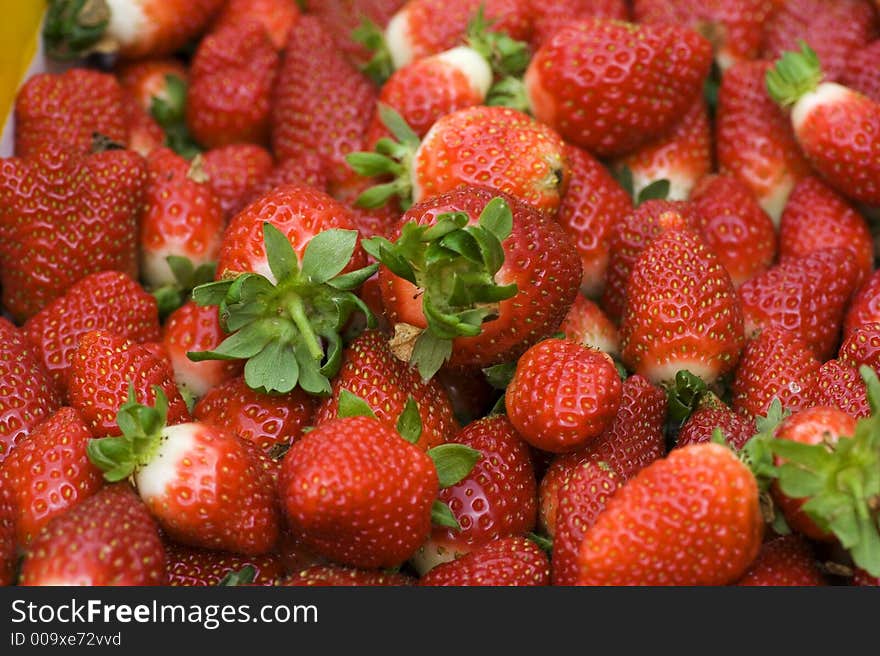 A stack of fresh strawberries from the farm.