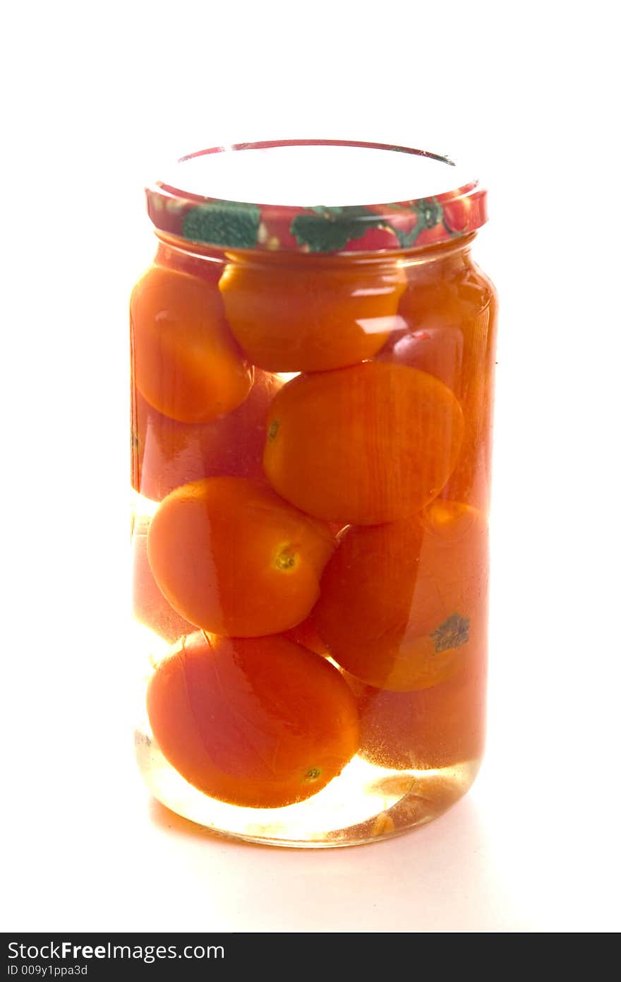 With a capacity of one the liter jar with tomatoes on a white background