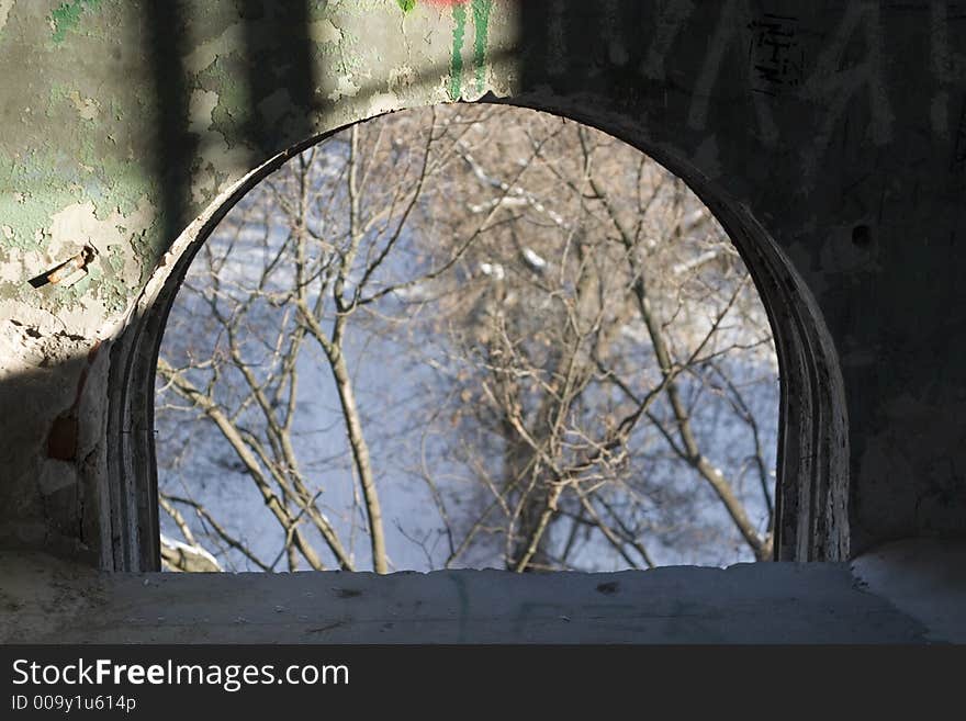 View from the window in the old abandoned building. Soft-focused, focus on the inside wall. View from the window in the old abandoned building. Soft-focused, focus on the inside wall