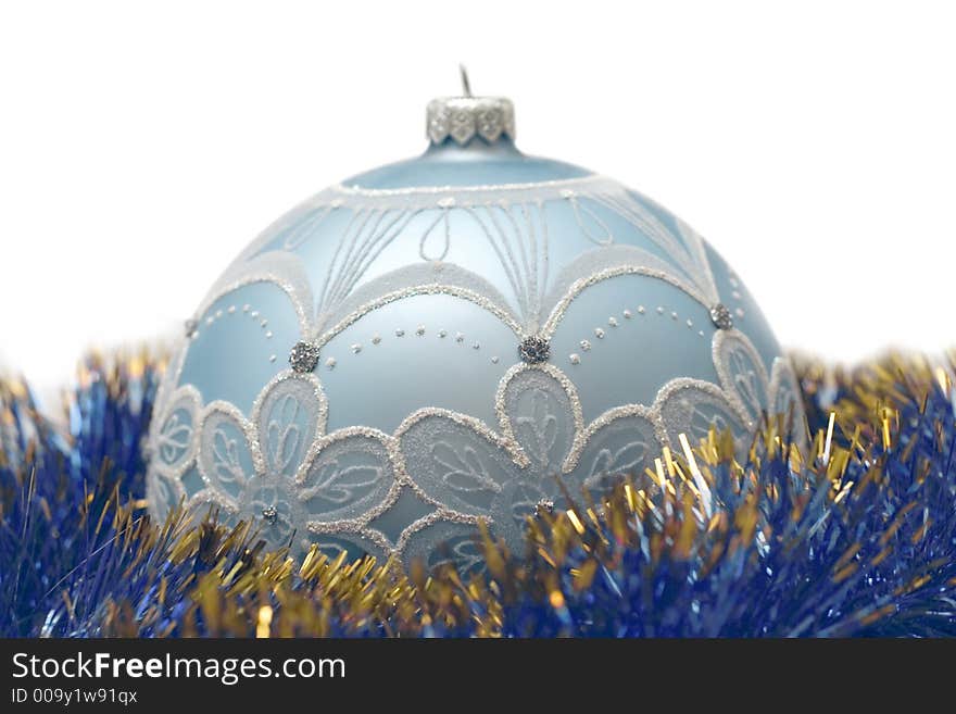 Blue christmas ball with gold and blue decor. Soft focused isolated objects. Blue christmas ball with gold and blue decor. Soft focused isolated objects.