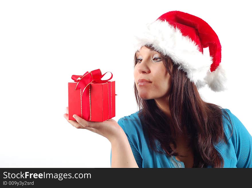 Attractive woman with santa claus hat and gift on white background. Attractive woman with santa claus hat and gift on white background