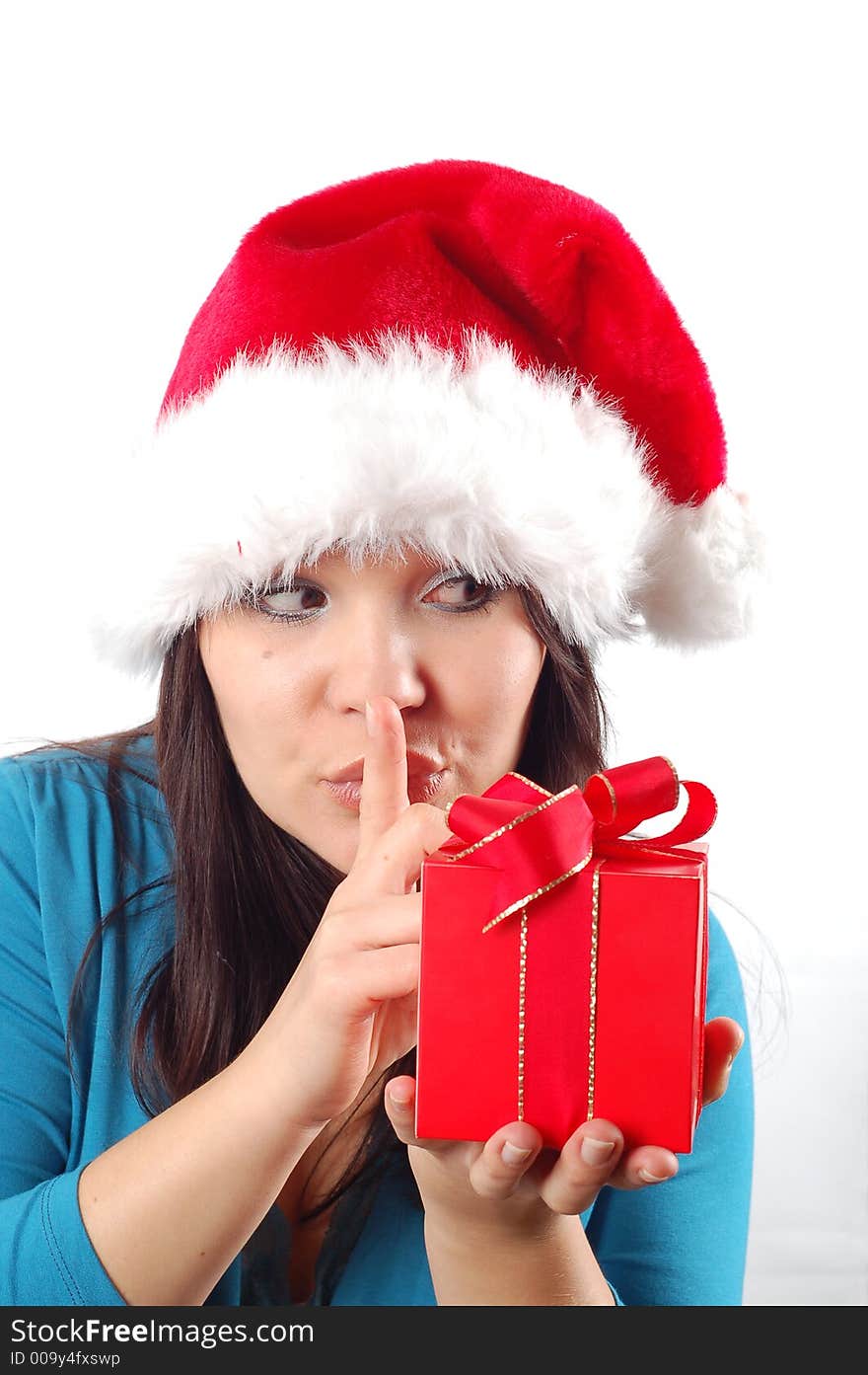 Attractive woman with santa claus hat and gift on white background. Attractive woman with santa claus hat and gift on white background