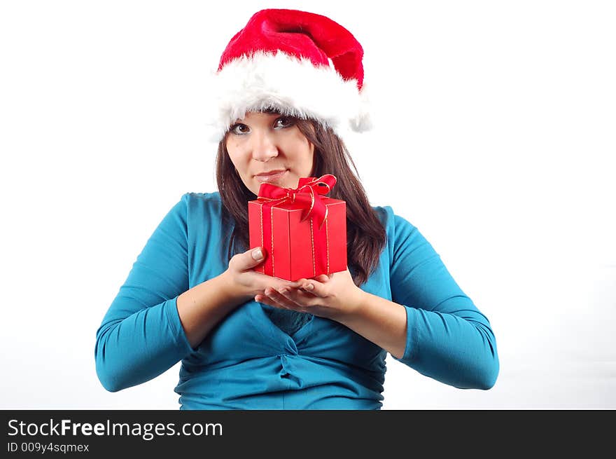 Attractive woman with santa claus hat and gift on white background. Attractive woman with santa claus hat and gift on white background