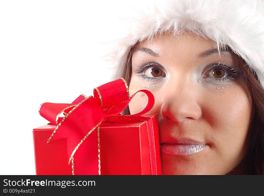 Attractive woman with santa claus hat and gift on white background. Attractive woman with santa claus hat and gift on white background