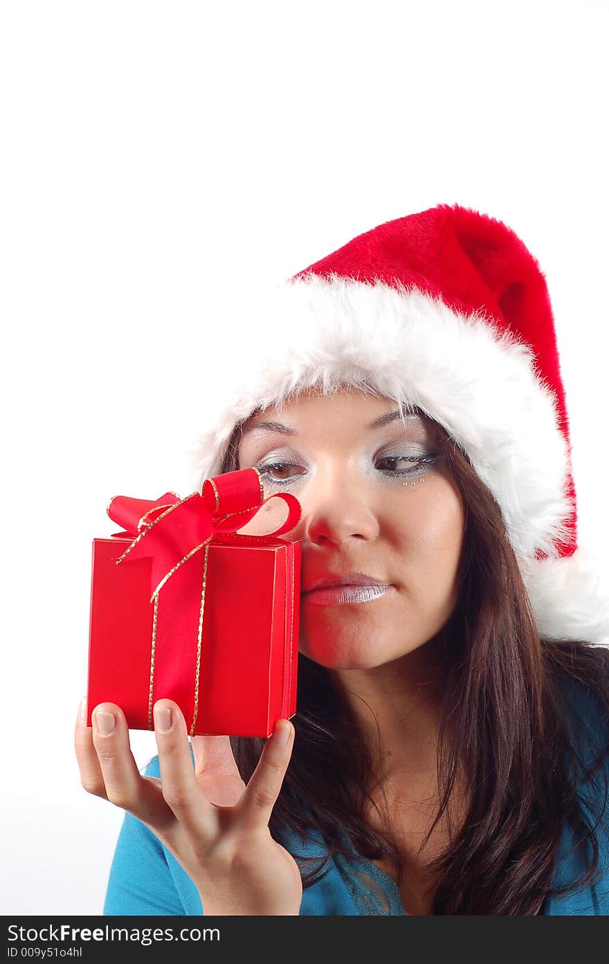 Attractive woman with santa claus hat and gift on white background. Attractive woman with santa claus hat and gift on white background