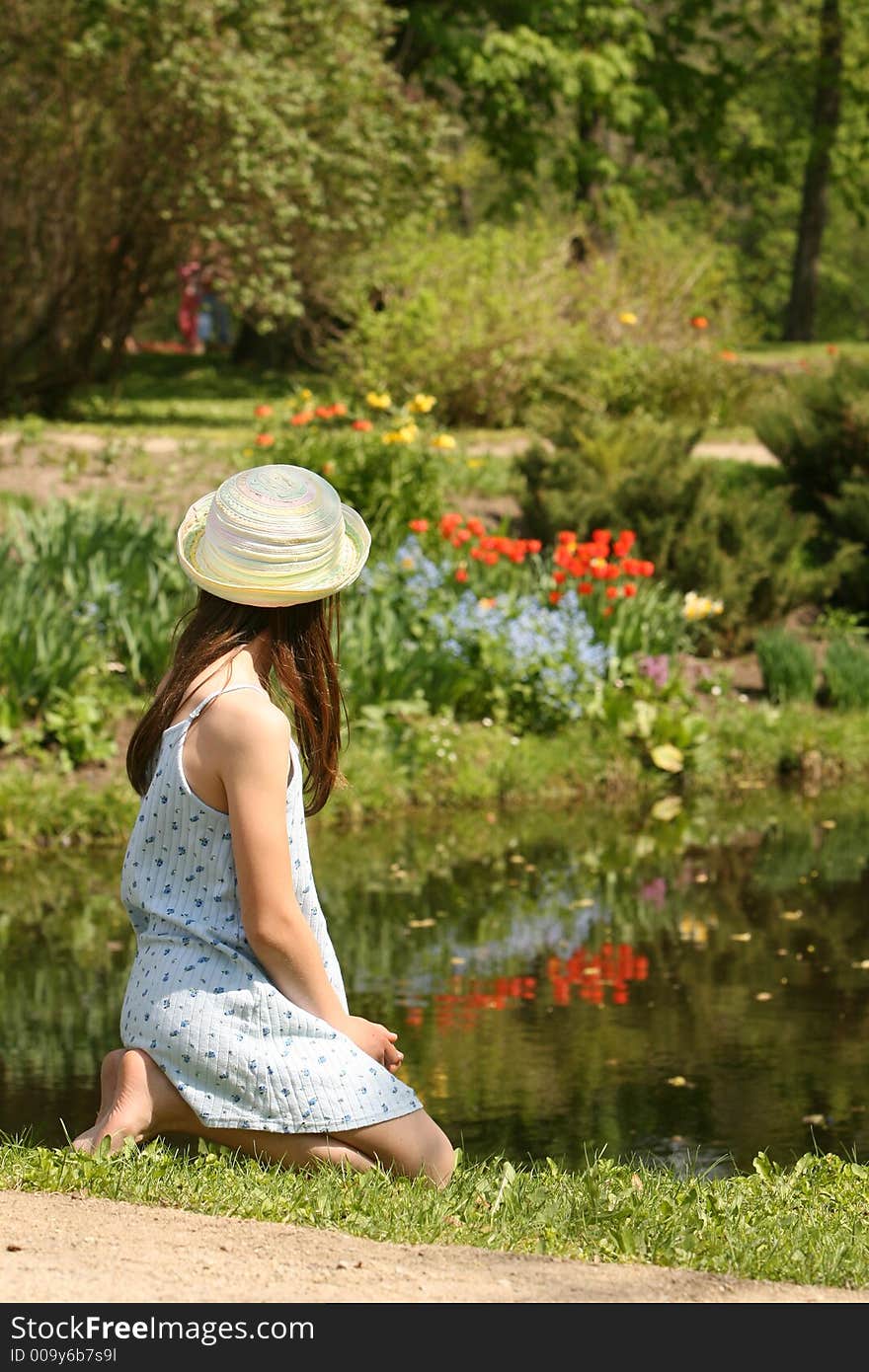 The girl with hat in the park of manor house. The girl with hat in the park of manor house