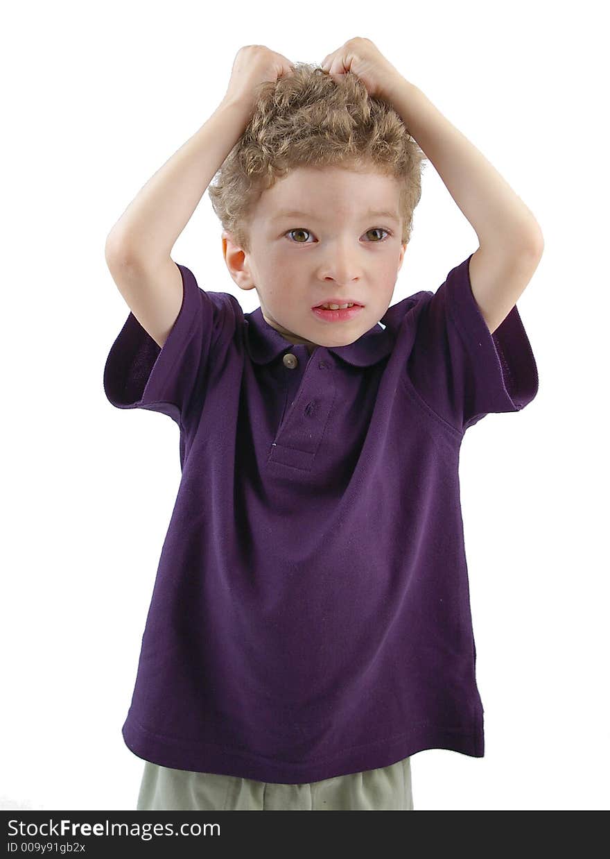 Toddler pulling his hair with violet shirt