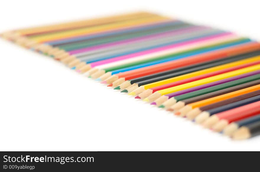 Lots of colorful crayons on a white background