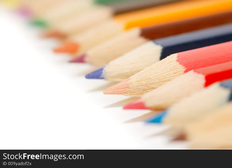 Lots of colorful crayons on a white background