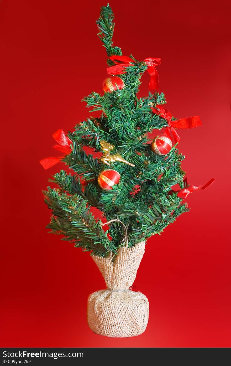 Christmas tree in a bright red background. Christmas tree in a bright red background