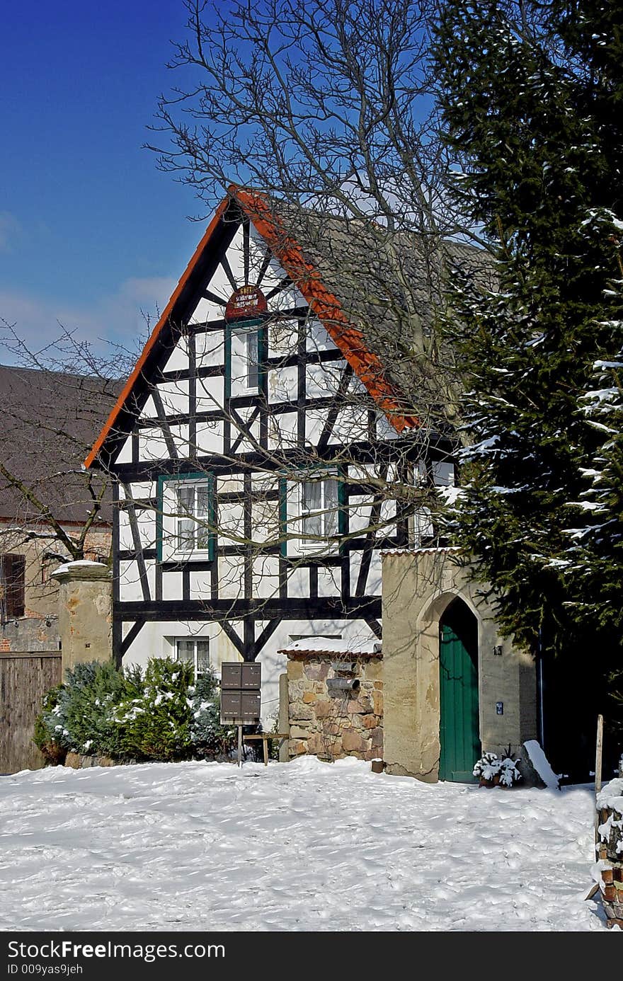 Half-timbered house in the snow somewhere in southern Germany. Half-timbered house in the snow somewhere in southern Germany