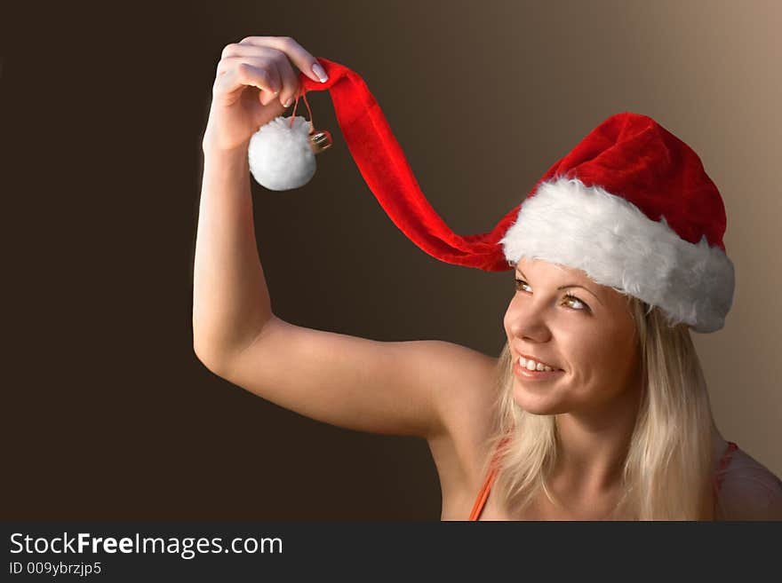 Smiling attractive woman with a Santa's hat. Smiling attractive woman with a Santa's hat