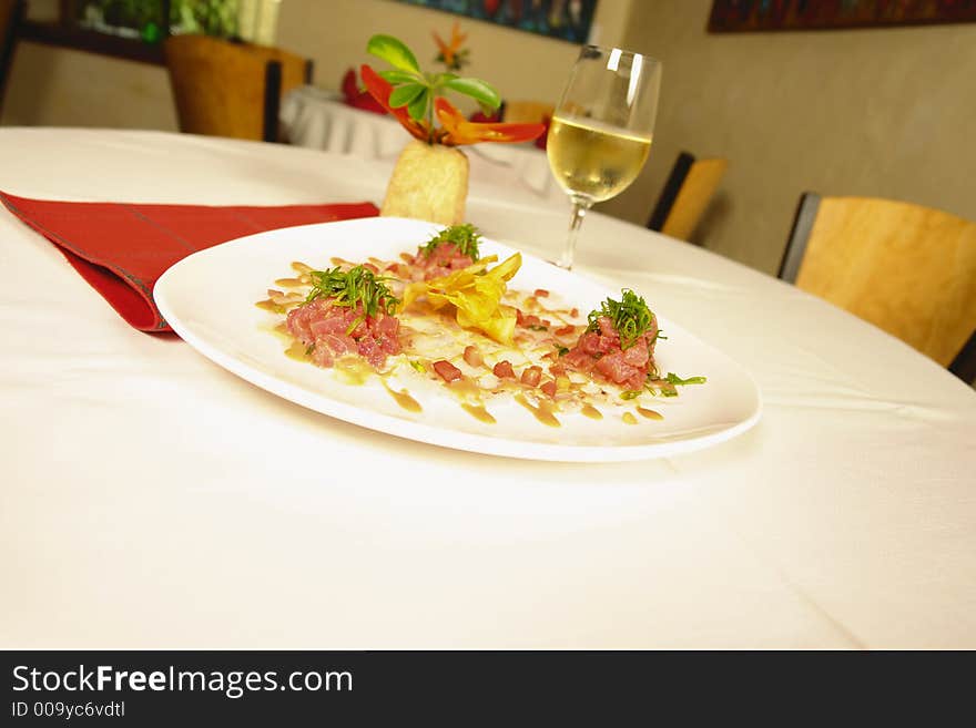 Italian appetizer from shirmp and octupus served with white wine in a restaurant