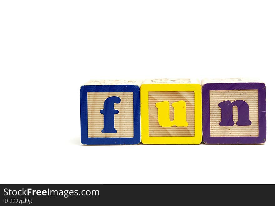 Arrangement of alphabet blocks spelling out the word fun in lower letters. Arrangement of alphabet blocks spelling out the word fun in lower letters