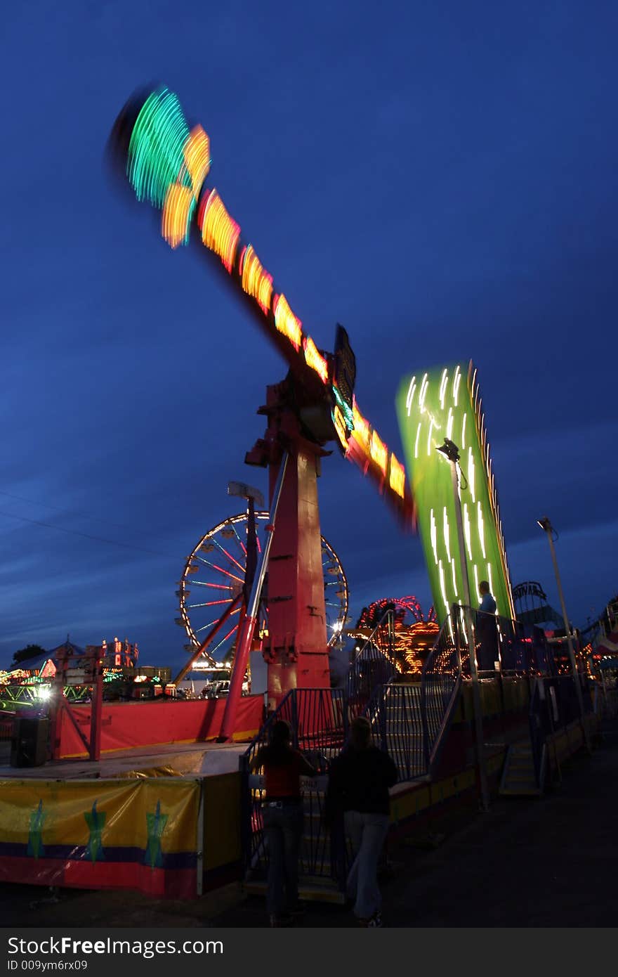 A Fair Ride blurs as the sun sets