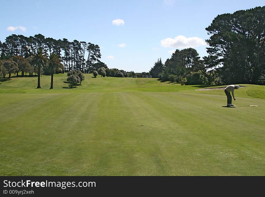 Old golfer on the green. Old golfer on the green