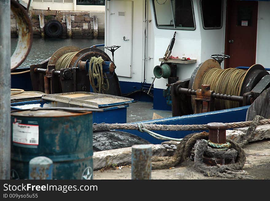 Fishing boat equipment, old rusty boat, ropes