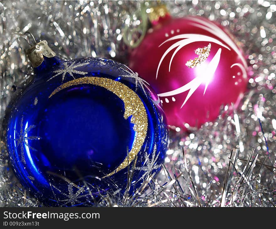 Blue and purple decoration balls on silver background. Blue and purple decoration balls on silver background