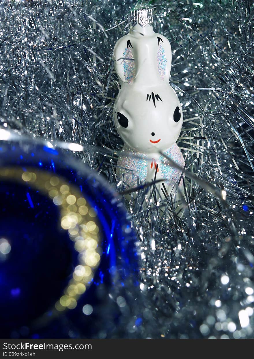 Christmas decoration white glass rabbit and blue closeup ball with golden moon. Christmas decoration white glass rabbit and blue closeup ball with golden moon
